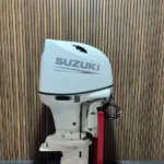 Suzuki 140 HP EFI outboard engine.